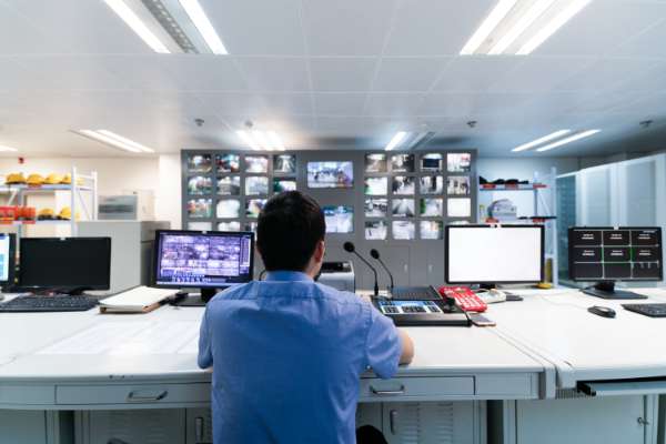 man in monitoring centre image