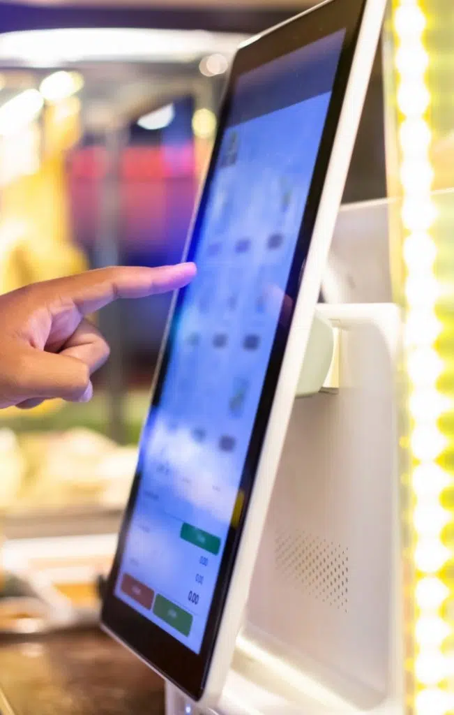 Person using self-service kiosk image