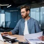 man on laptop working image