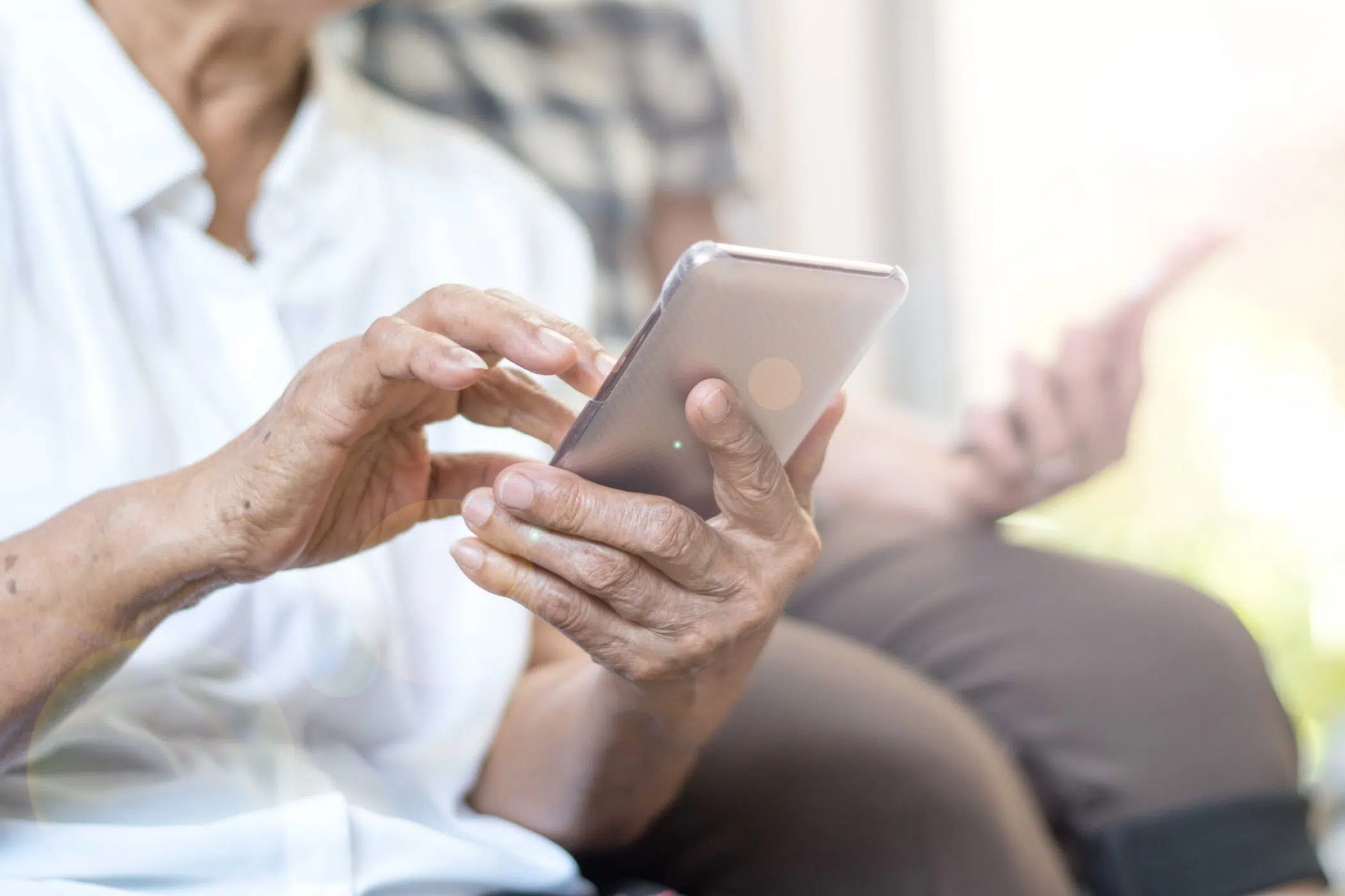 senior women using tablet smartphone image