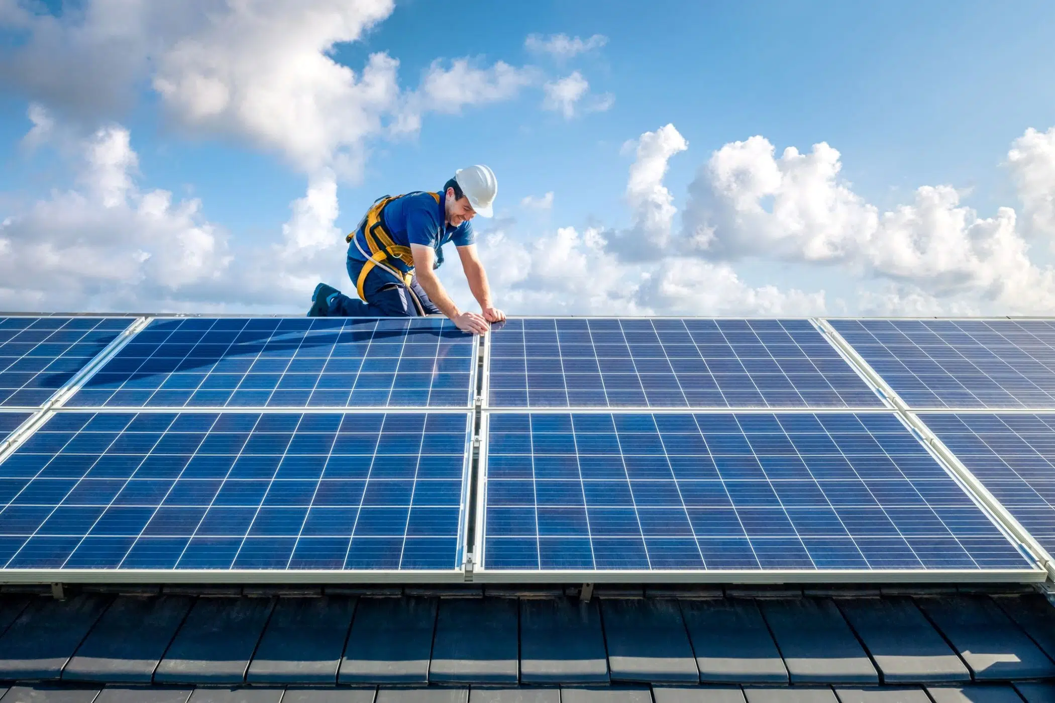 man fixing solar panels image