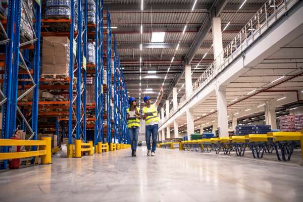 2 workers in warehouse image