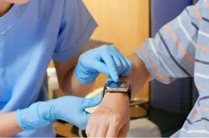 nurse showing patient health monitoring watch image