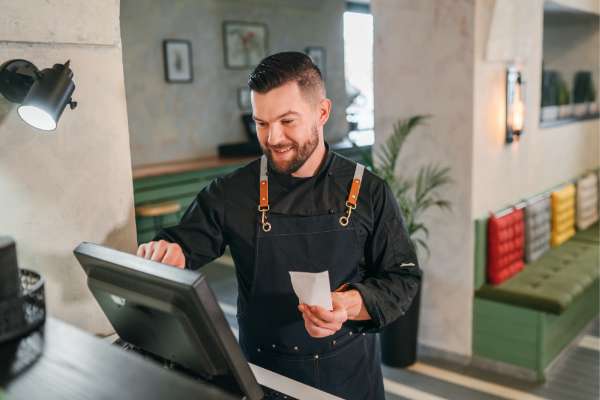 man at point of sale system image