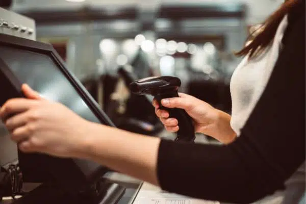 woman using scanner in retail image
