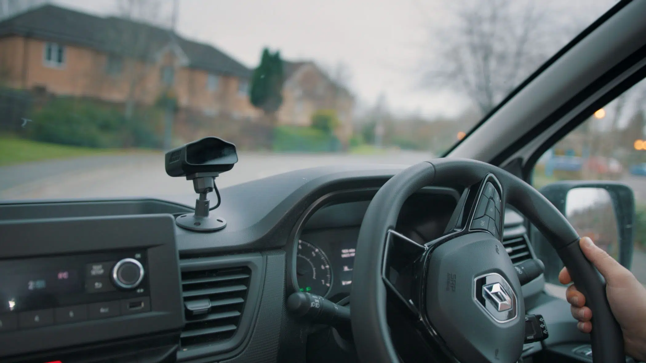 close up of hand on car steering wheel image
