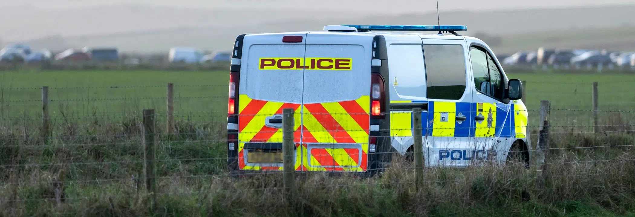 Police van in field image