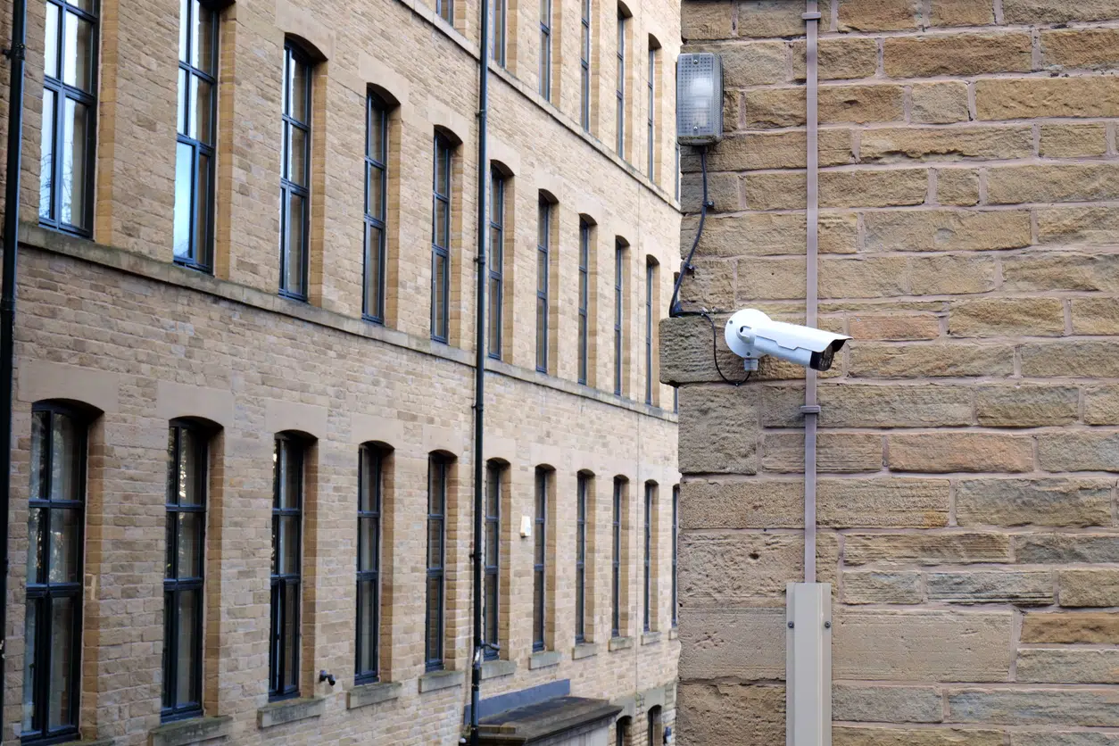CCTV looking sideway on brick building image