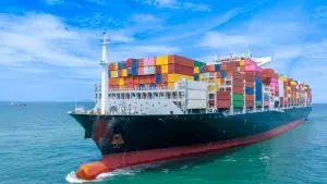 Aerial side view of smart cargo ship carrying containers image