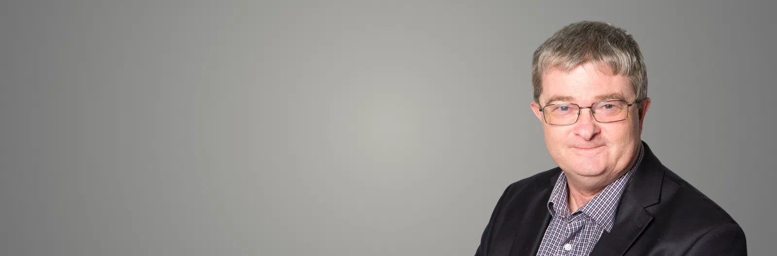 Kerry Knight Headshot Hero Image with grey background